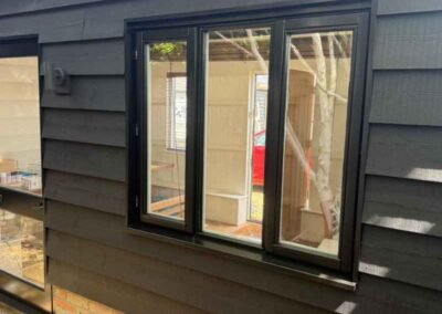 Windows and wooden exterior renovated and painted in Cambridge