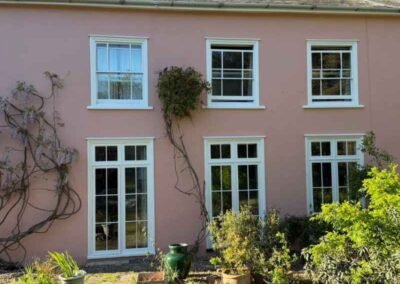 Pink house with white windows in Cambridge